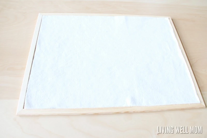 This simple DIY Cork Board is easy to make, inexpensive, and pretty too! Get easy step-by-step instructions here: