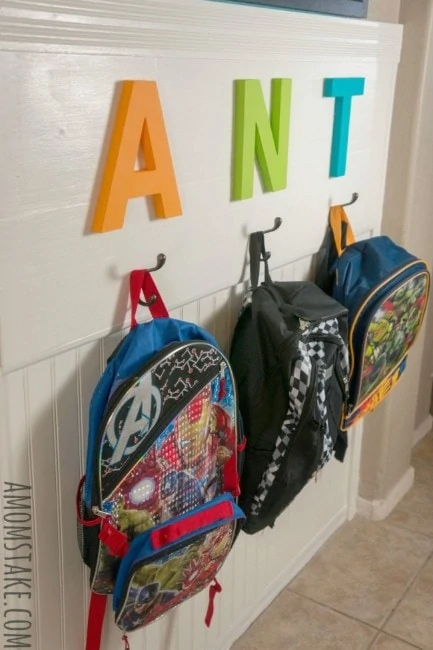 DIY Backpack Station with hanging backpacks