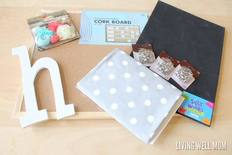 This simple DIY Cork Board is easy to make, inexpensive, and pretty too! Get easy step-by-step instructions here: