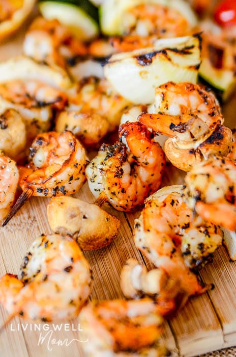 Grilled shrimp skewers covered in seasoning. 
