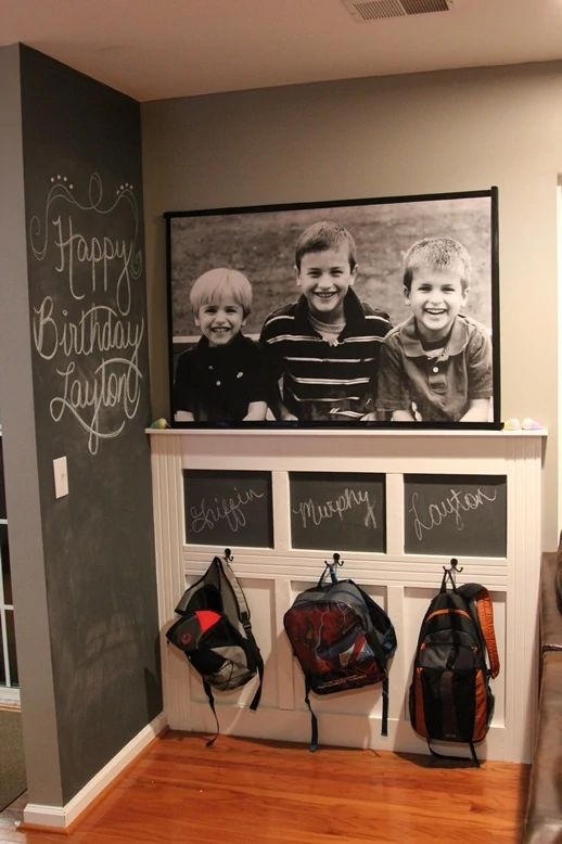 The Backpack Wall with chalk paint walls and hooks for backpacks