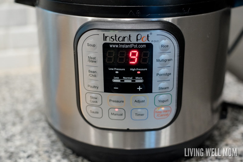 Pressure cooker time being set to cook butternut squash. 