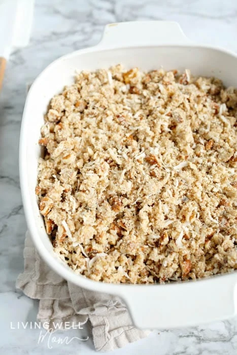 apple crisp covered with pecan and coconut topping