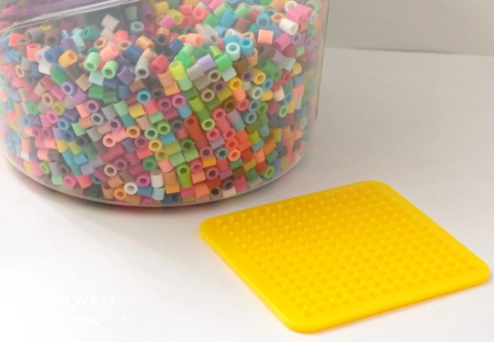 perler beads and a yellow board
