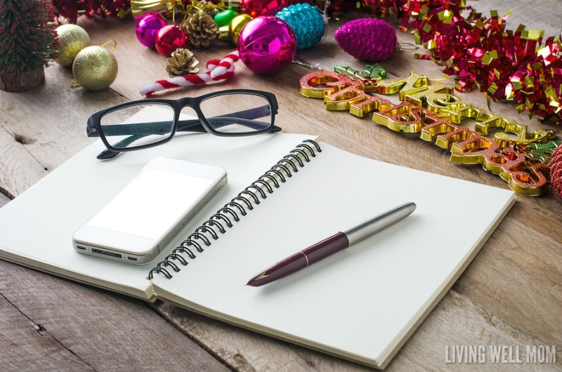 notebook with pen, glasses, and ornaments