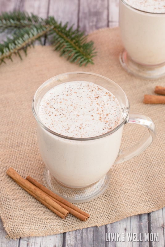 eggless eggnog in a glass with nutmeg and pine needles