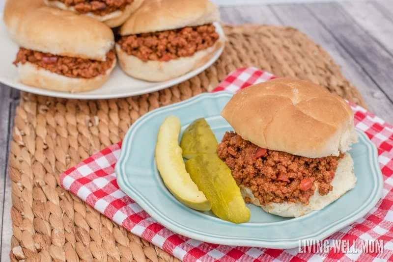 horizontal image of a sloppy joe sandwich on a plate