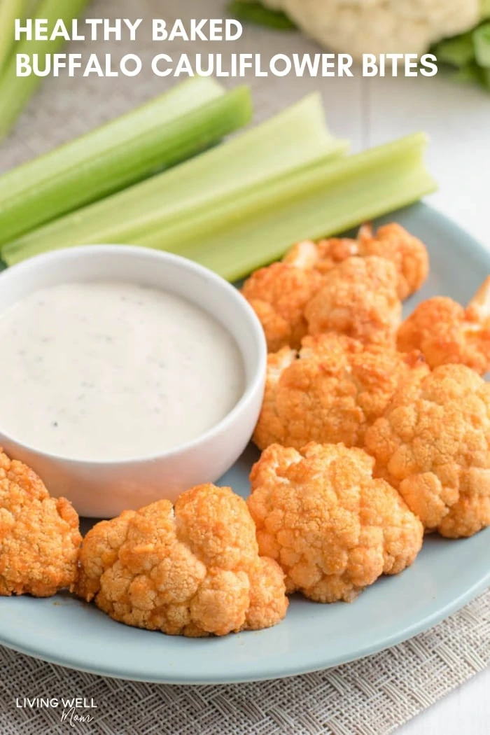 Paleo roasted Buffalo cauliflower bite on a plate with celery and a dip 