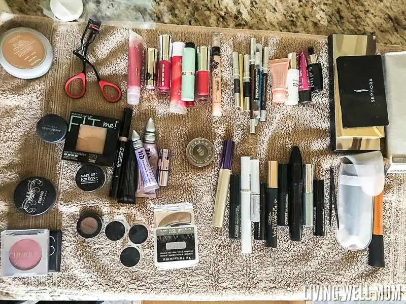 organizing make up collection on a towel