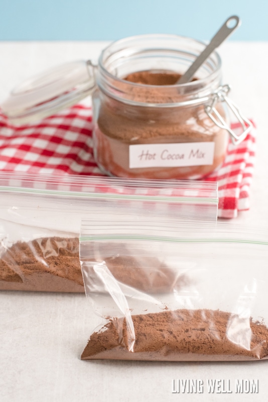 plastic zippered bags with homemade hot chocolate mix and jar in the background