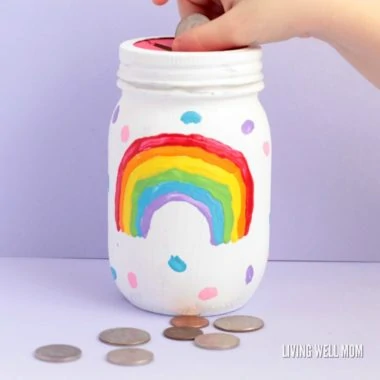 Love simple kid-directed DIY projects? You'll love this fun rainbow mason jar piggy bank for girls! Kids will love making their very own bank!