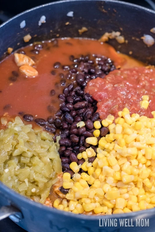 Black beans, green chilies, corn and salsa in added to a Mexican casserole dish.  