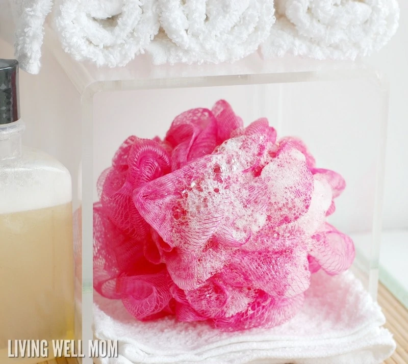 a pink loofah with soap suds