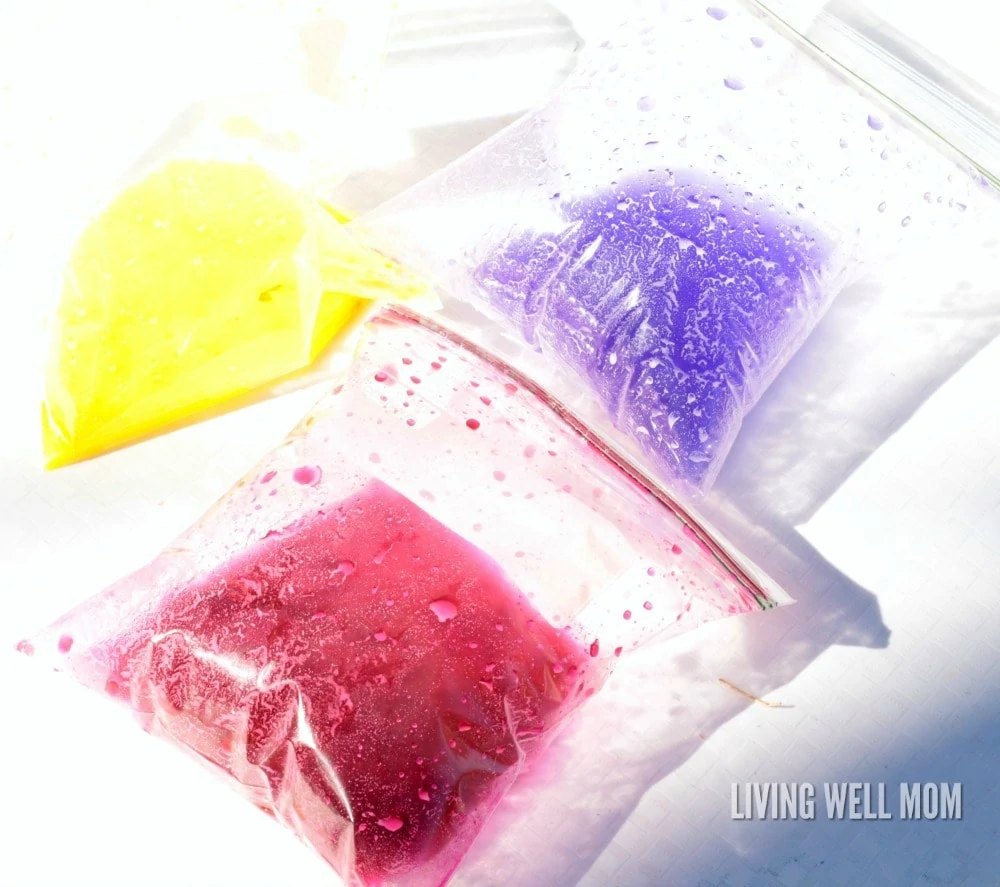 three baggies filled with baking soda, vinegar and food coloring