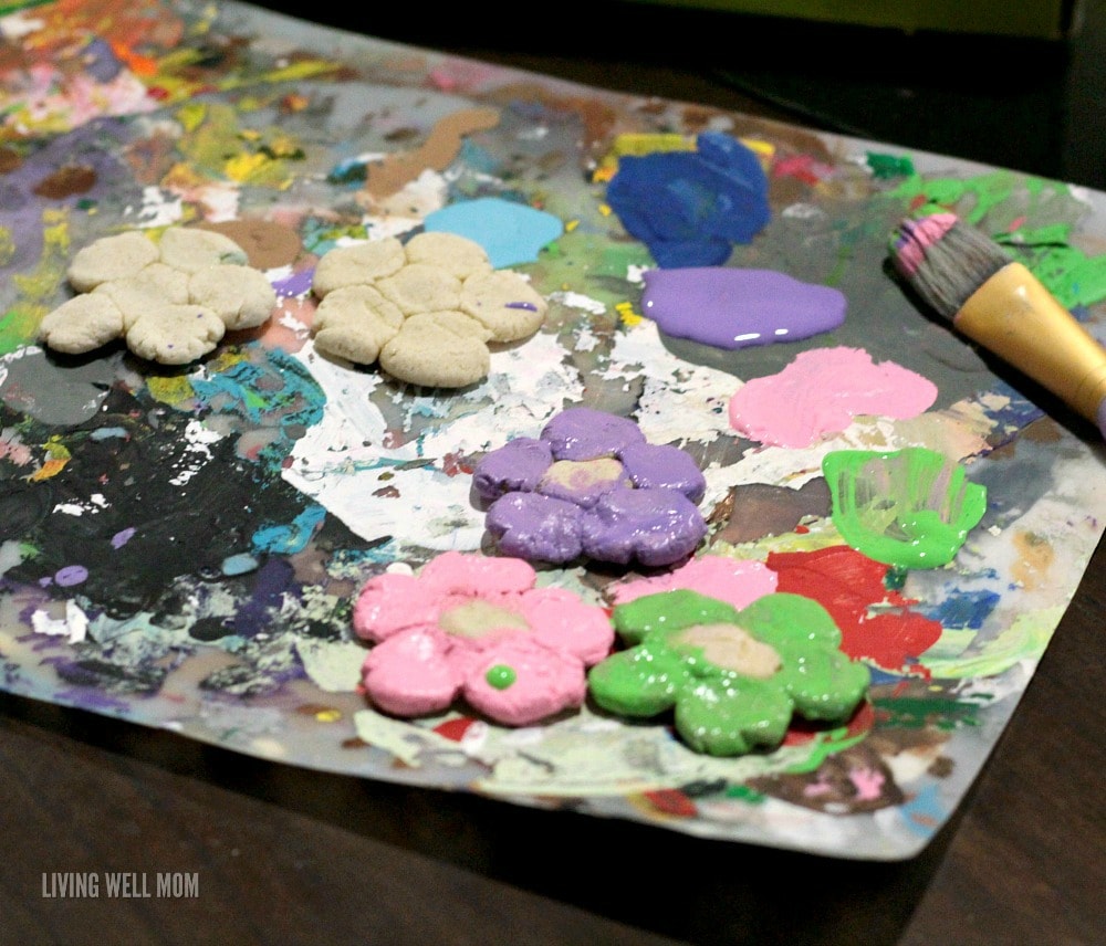 Delightful salt dough flower magnets are the perfect way to preserve your children's fingerprints in a fun, spring-themed project! Kids will love this fun activity!