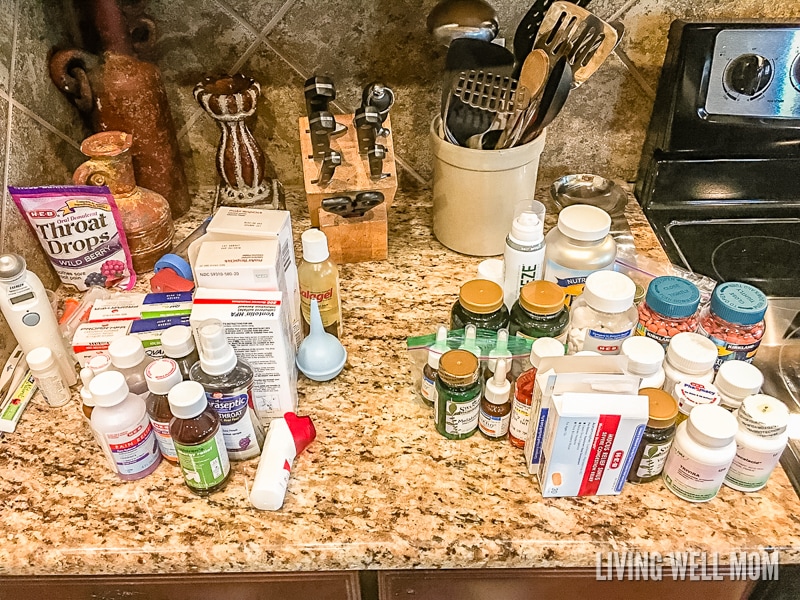 lots medicine bottles and boxes gathered together on a countertop 