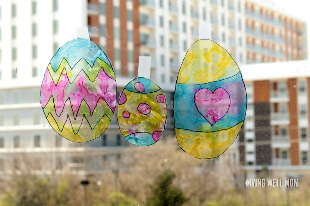 easter egg suncatchers on a window in the city