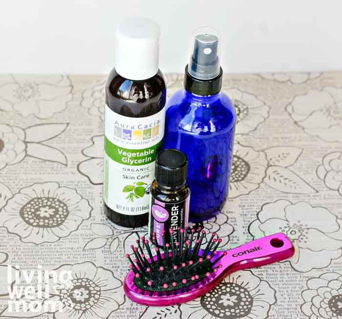 essential oil & vegetable glycerin next to a brush and spray bottle