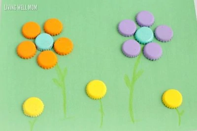 Make an adorable bottle cap garden when you make these painted bottle cap flowers! Kids will love this simple and fun craft.