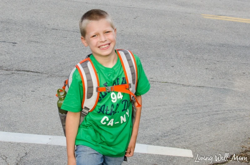 A little boy that is standing in a parking lot