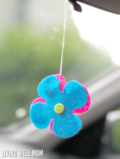 homemade essential oil car freshener hanging above dash board