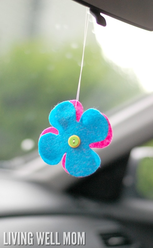 blue and pink DIY air freshener hanging from rearview mirror