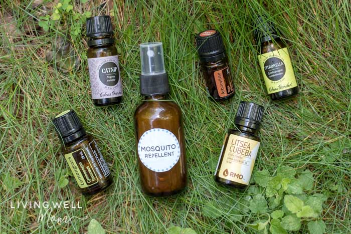 homemade mosquito repellent with essential oils in grass