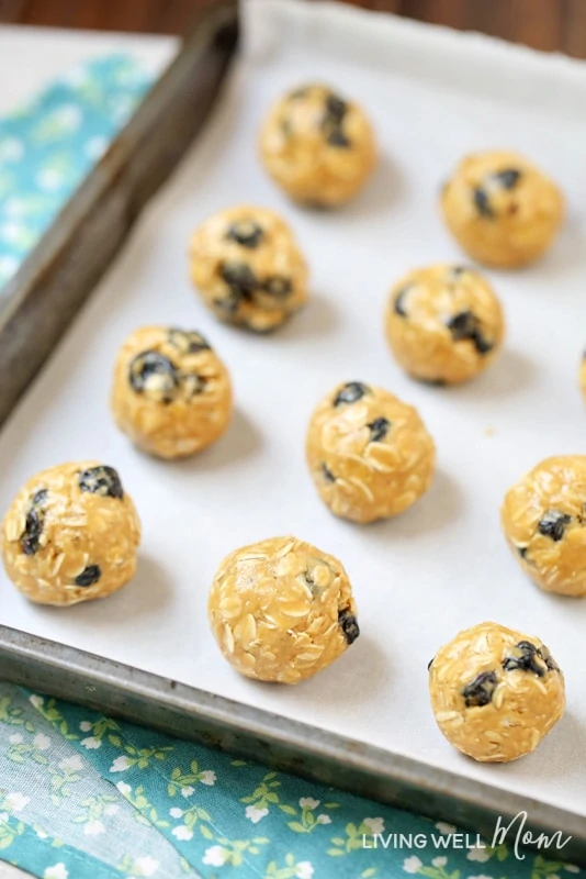 easy no-bake energy bites on parchment paper cookie sheet