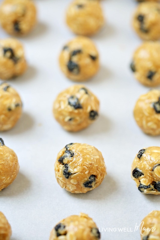 dried blueberries energy bites on a parchment sheet