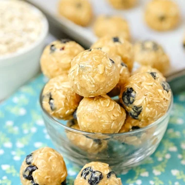 5-Minute Blueberry Snack Balls - this simple 5-ingredient recipe is naturally gluten-free, dairy-free, vegan, and nut-free too! We love this protein-packed snack for kids at school or at home. Plus this recipe is so quick and easy to make, my kids make it themselves!