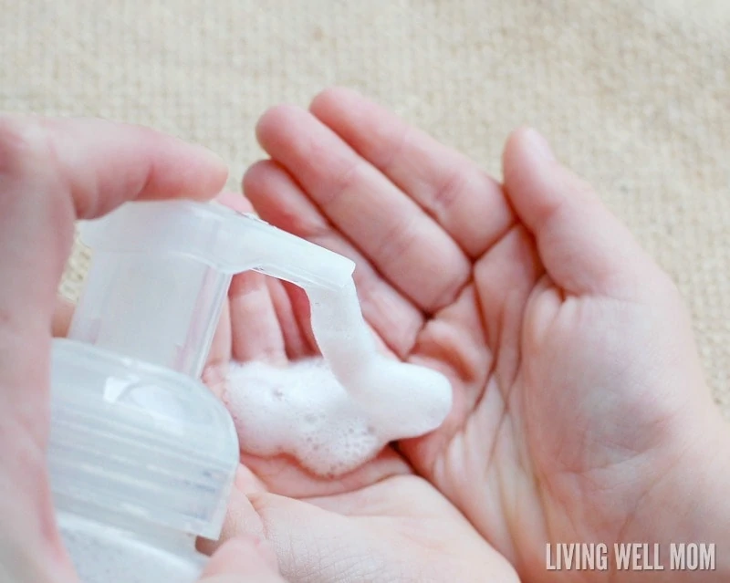 DIY foaming hand soap being pumped into a child's hand. 