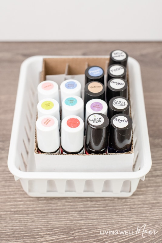 This simple solution for organizing essential oil roller bottles is genius! It's practically free, doesn't require any DIY talent, and works perfectly for keeping roller bottles stored upright with convenient, easy-to-find access.