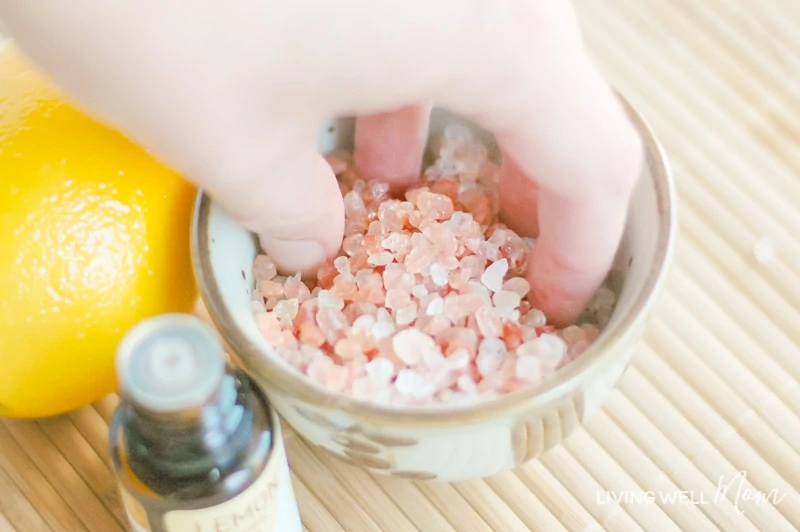 a person mixing up a bowl of Himalayan salt by hand