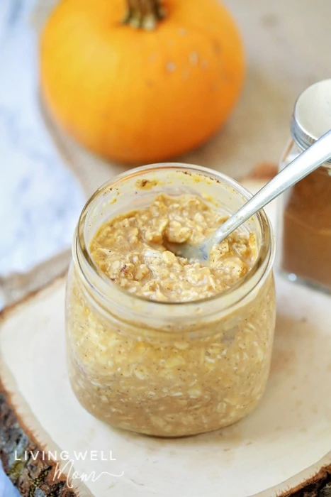 a glass with pumpkin `pie overnight oats