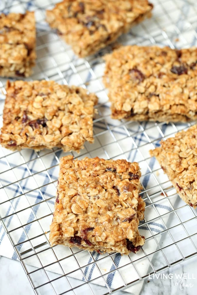 Cranberry Granola Bar Squares are a nutritious, moist, chewy granola bar square filled with oats, crispy rice, and dried cranberries. This is an easy, delicious, gluten-free and dairy-free snack recipe kids love!