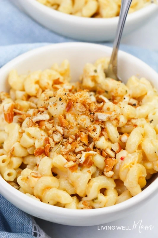 Pretzel crumb topping on gluten-free macaroni and cheese in a bowl.