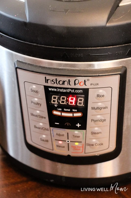 An instant pot being set to cook homemade mac and cheese. 