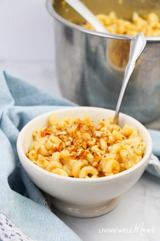 Homemade macaroni and cheese in a bowl with a spoon.
