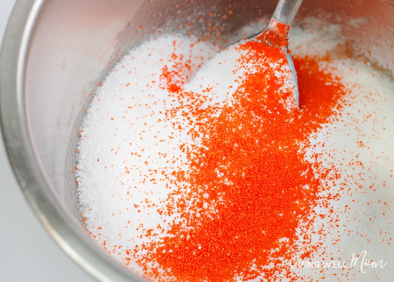 jojoba beads being mixed into diy sugar scrub