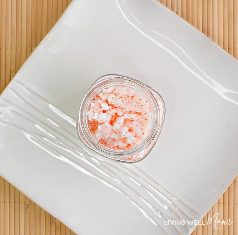 exfoliating citrus scrub added to storage container