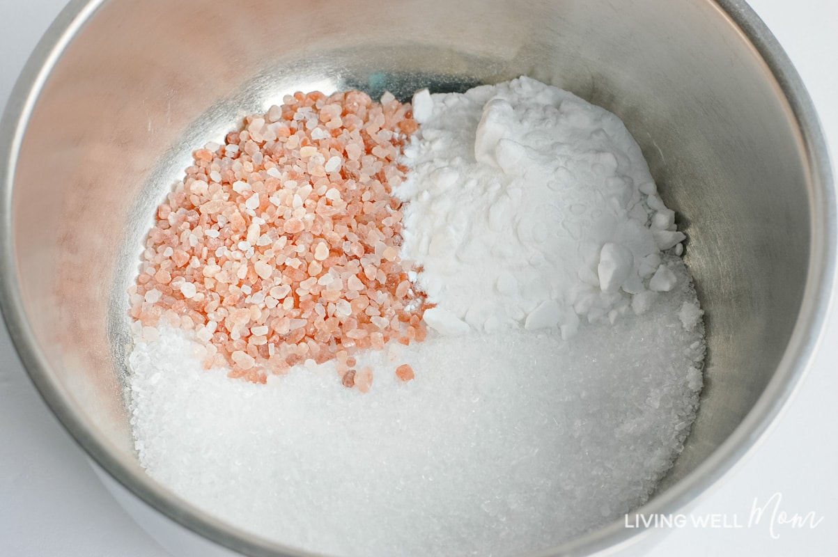 Epsom salt, baking soda, and Himalayan salt combined in metal bowl