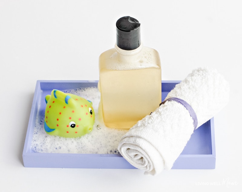 Bottle of DIY bubble bath with wash cloth
