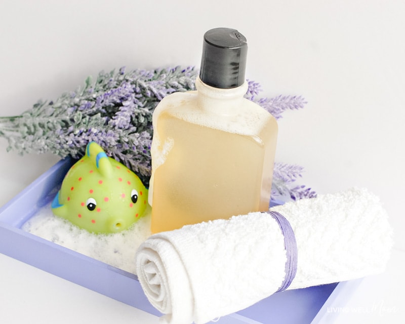 calming homemade bubble bath on a tray next to lavender