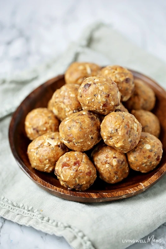 energy balls made with peanut butter and dates in a wooden bowl