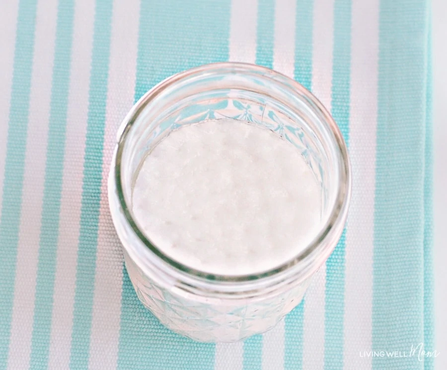 A jar of facial pads soaking in homemade toner. 