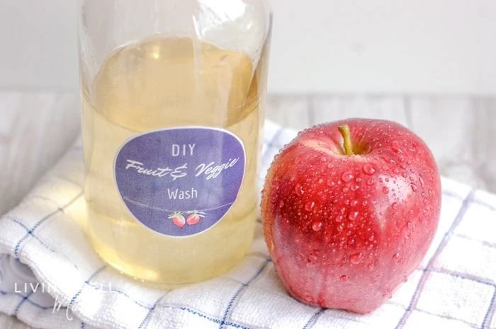 DIY fruit wash next to a freshly washed apple. 