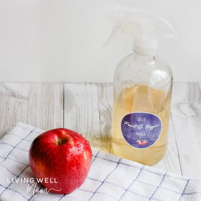 A spray bottle of produce wash using vinegar and essential oils. 