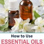 jasmine essential oil, flowers, and bottle