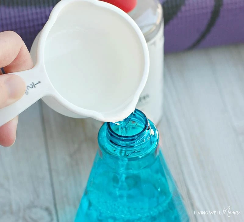 Pouring ingredients into spray bottle