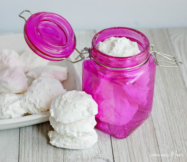 Homemade garbage disposal cleaning bombs in a pink jar made with natural ingredients. 